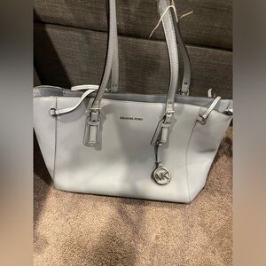 Baby blue Michael kors voyager purse.